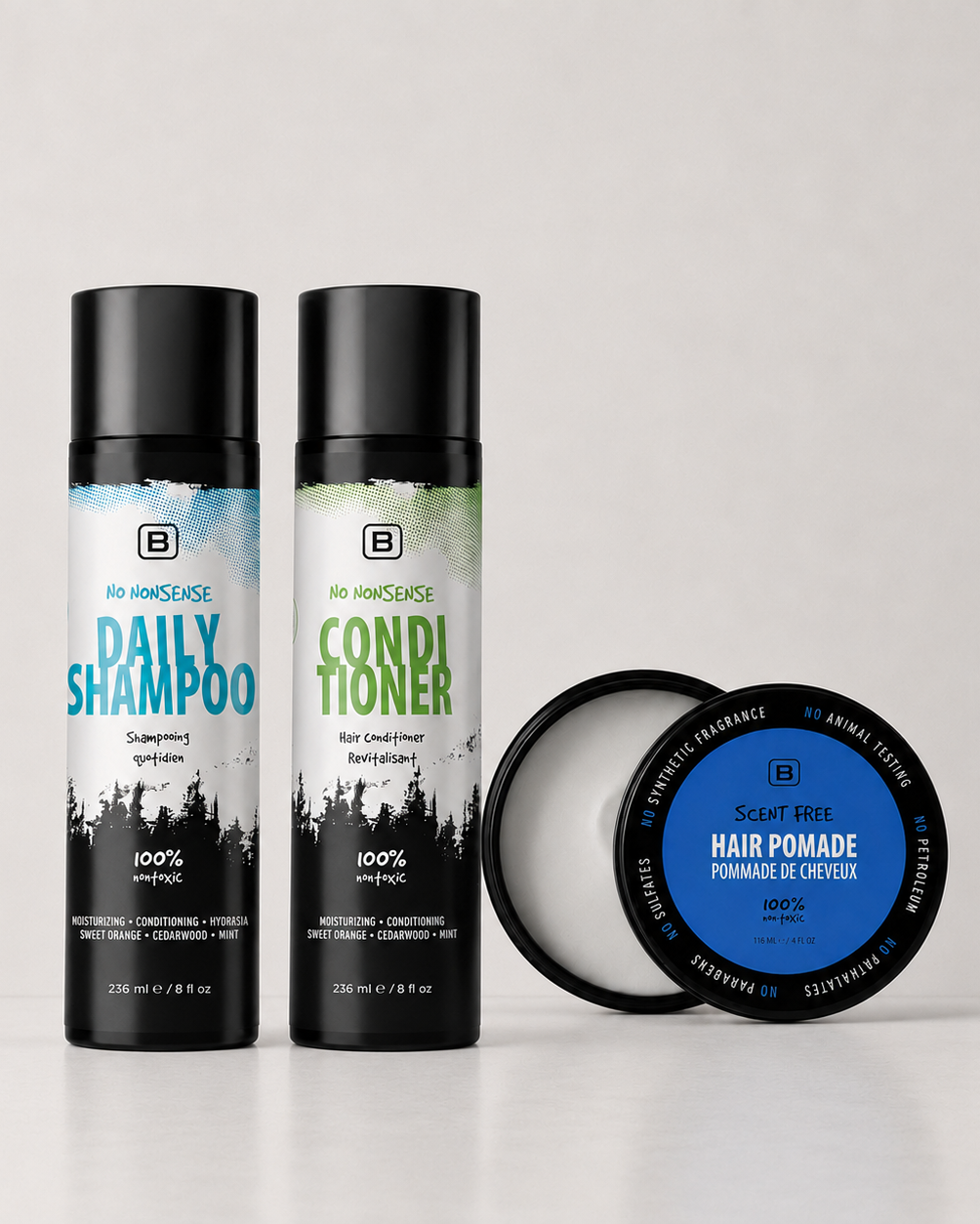 Three hair care products including a shampoo, conditioner, and hair pomade on a light gray background.